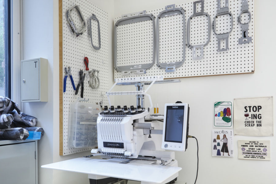 Fibers Lab Facility |SVA BFA Fine Arts. A Brother 10-needle embroidery machine sits below pegboard racks holding hoops and tools.