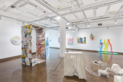 BFA Fine Arts Exhibition Liminality. SVA Chelsea Gallery, New York. Installation view. Multiple abstract paintings hanging from the wall, multiple sculptures of different objects and shapes on the floor.