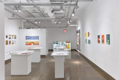 Exhibition The Printed Image 2019. SVA Chelsea Galleries, New York. Installation view multiple printed images hanging on the wall and some laying on pedestals.