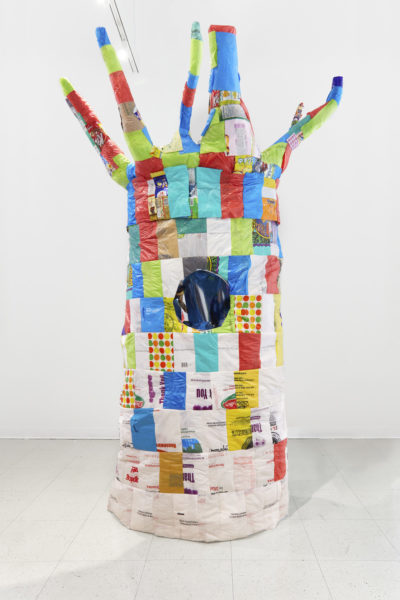 Artwork by Sophy Chang. BFA Fine Arts, 2019. Mixed media sculpture shaped like a tree using multiple colored pieces of plastic.