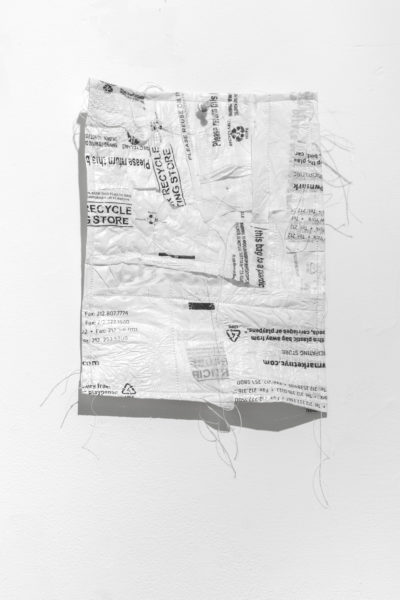 Artwork by Ziwei David Shao. BFA Fine Arts, 2019. Assemblage using plastic shipping envelpopes.