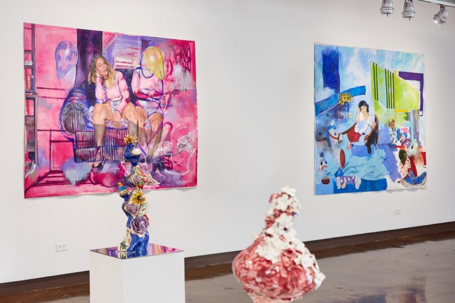 Installation view with 2 colorful large portrait paintings and 2 medium-size ceramic organic sculptures.
