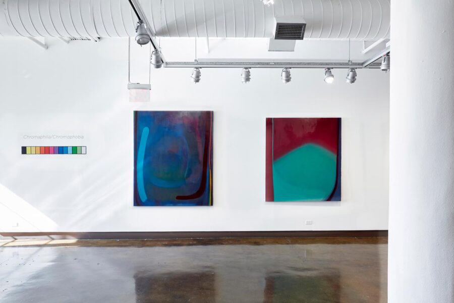 Installation view with 2 large chromatic abstract paintings.