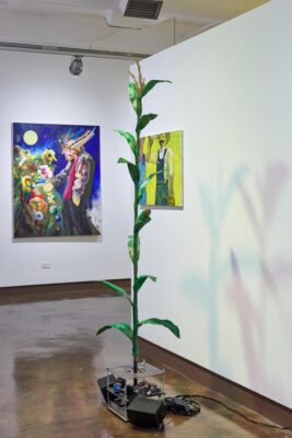 Installation view with two paintings and one sculpture