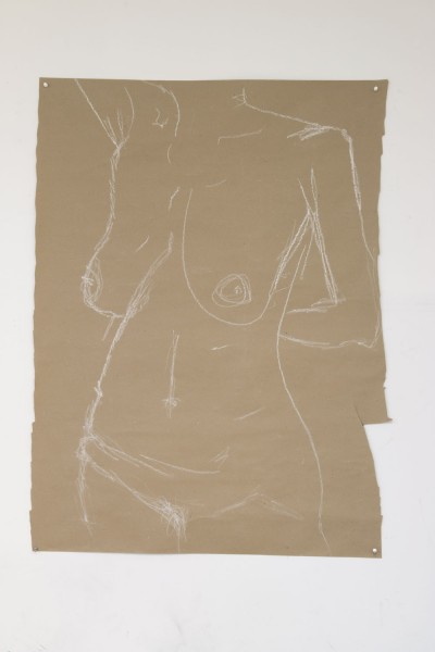 Hand drawing with white color on a brown paper of a woman body with one hand at her back, one hand raised up, with breasts uncovered and wearing just pants