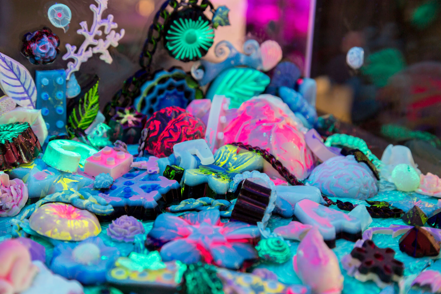 Detail shot of agar sculptures painted with fluorescent bacteria