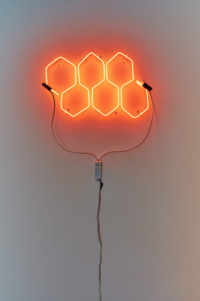 Artwork by Melissa Rose Pressler. BFA Fine Arts, 2019. Installation view. Neon sign with six orange hexagons.