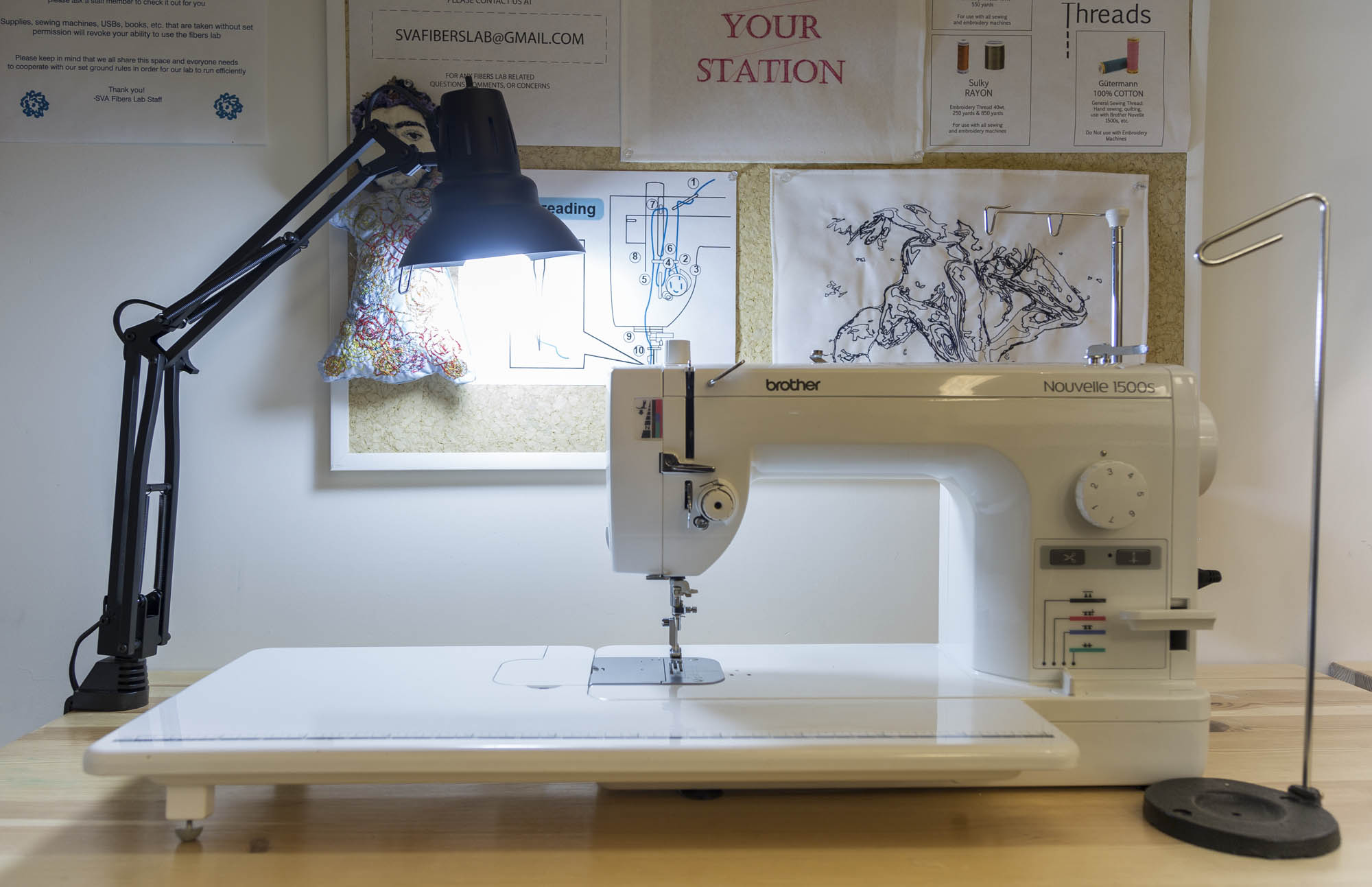 A close view of Brother Nouvelle 1500S sewing machine and a lighting lamp on the left side of the machine