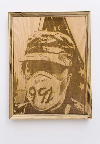 Portrait of a person on a wood surface in a wooden frame, with  face mask, a military camouflage hat, eyes in the shadow, and USA flag behind the person