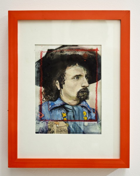 Portrait painting of a male person with mustache and beard, long hair, a big hat, and blue coat placed in an orange wooden frame 