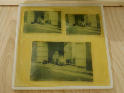 Three images printed on a sheet of translucent yellow bioplastic.