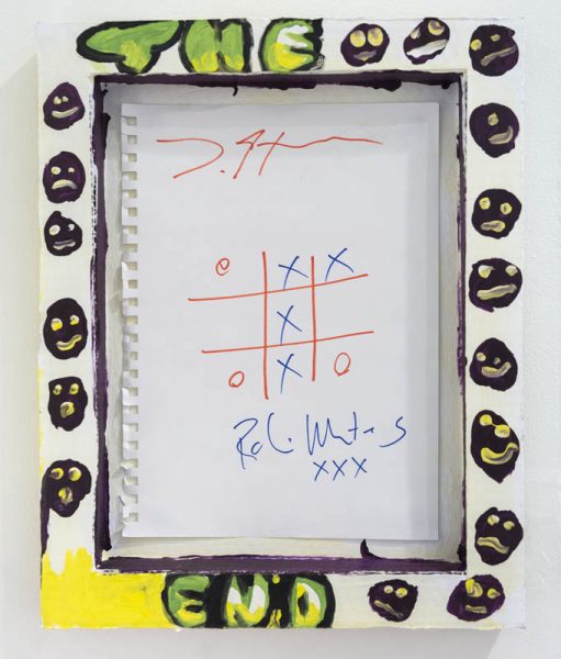 A tic-tac-toe game played on a white paper. The grid is drawn with red, O is with red, and X with blue. The blue wins the game with an X column in the middle of the grid. At the top and the bottom of the page is an undistinguishable text written. The piece of paper is mounted inside a white wood frame with the words THE and END written on the top rail and the bottom rail of the frame. Besides The End, words are drawn smiley faces with happy, neutral, and sad expressions in black with yellow eyes and mouth