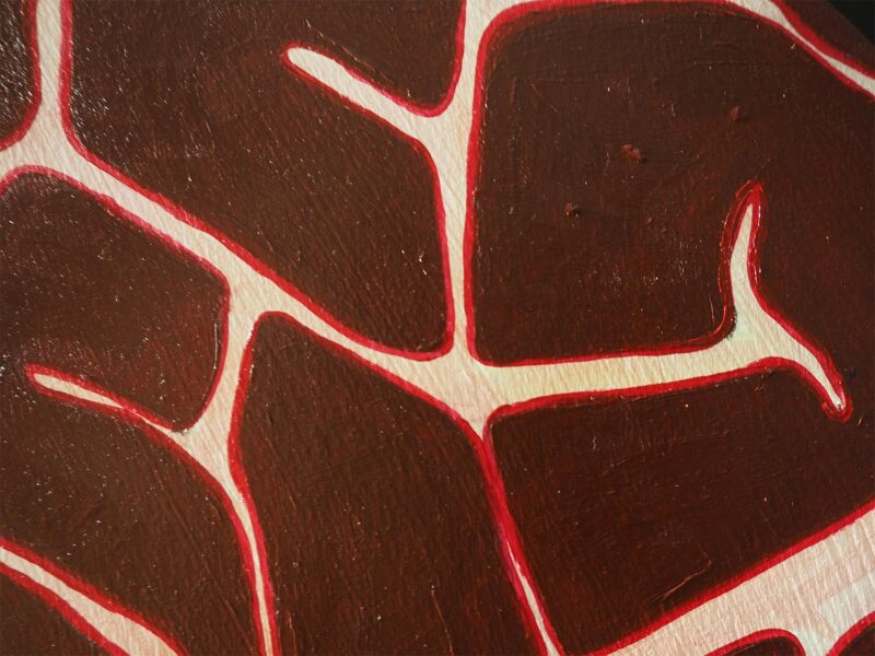 An abstract painting in shades of red.