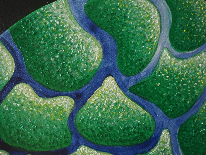 Abstract painting of irregular green shapes on a blue ground.