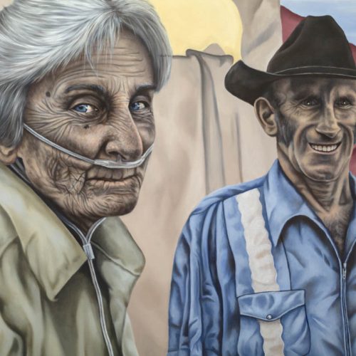 The painting represents two old men, one with white hair and a medical device under nouse, and a yellow shirt. The other one wears a blue shirt and a black hat and has a big smile on his face. In the back is a big tent with red and beige fabric