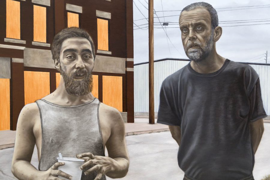 The painting represents two men in the street with a brown building on the left side and a big warehouse on the right side. The man on the left is shorter than the man on the right. He wears a white undershirt, has a long beard, medium cut hair, and holds a white glass in his hand. The man on the right has a short beard and short haircut, and he wears a black t-shirt