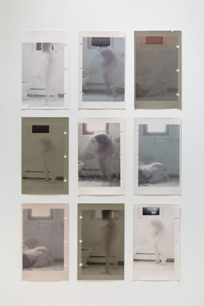A grid of nine prints representing a woman in nine different posings in a bathroom with a window behind her