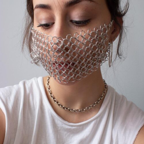 Emma Fasciolo wearing a chainmail mask.