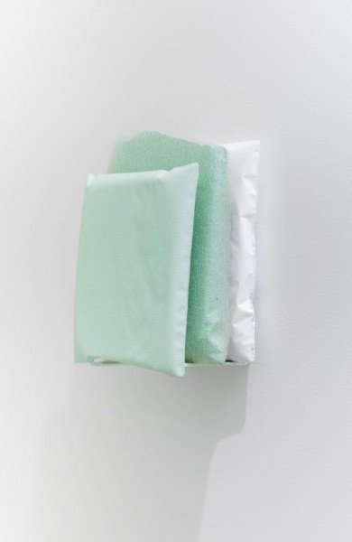 Three rectangular pieces glued on top of each other, two mint-green and one white, made of polyester and plastic