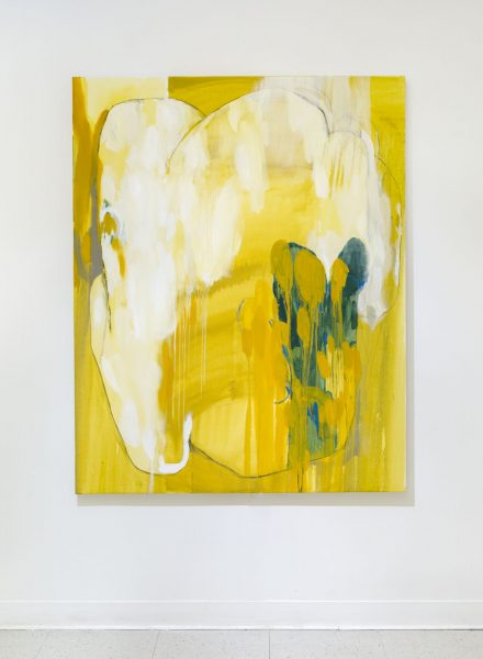 Rectangular abstract painting of yellow with a blue shape in the foreground and a medium yellow background, very drippy.