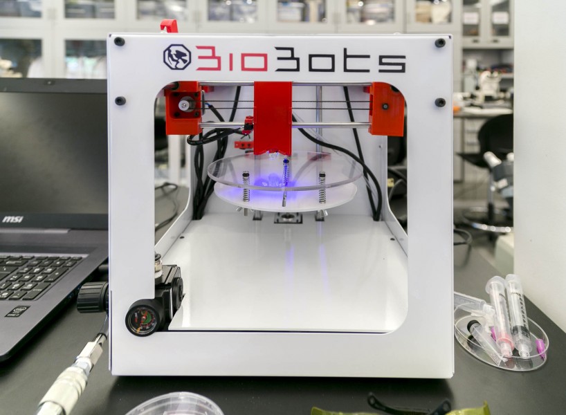 A high resolution 3D bioprinter with a laptop on the left side.