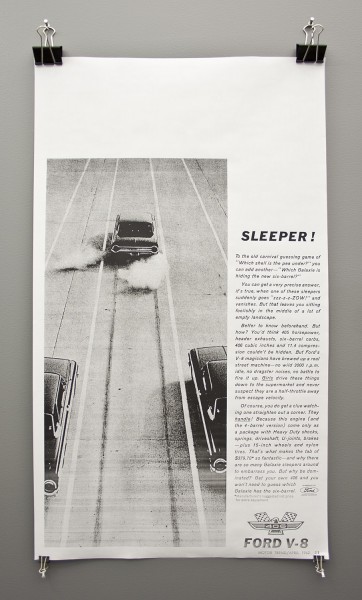 A paper page with an advertisement of a Ford V8 with the title SLEEPER! and an image with a fast car leaving two cars behind and a three-paragraph text. 