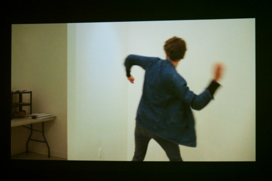 Image projection with back view of a person preparing to throw something.