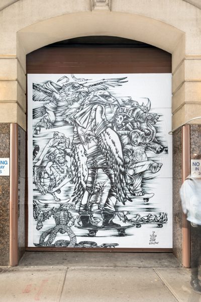 Artwork by Julio Cesar Candelario. Black and white mural with multiple figures and objects.