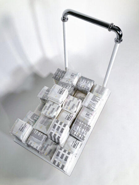 Upper view of a mover’s cart with sanitary napkins stacked on top