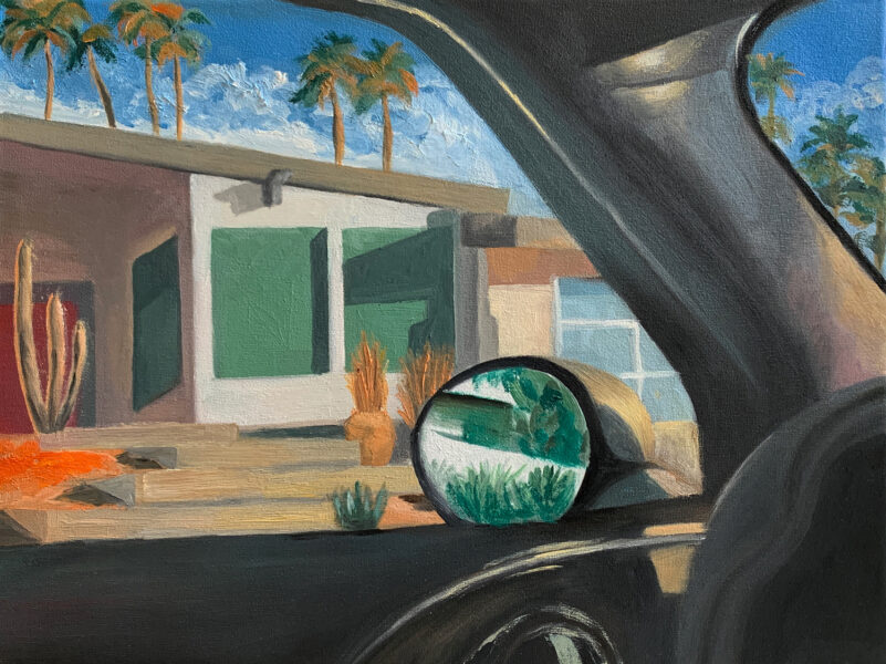 Landscape painting of southwest style housing seen through driver's side wide. Side mirror is visible in painting.