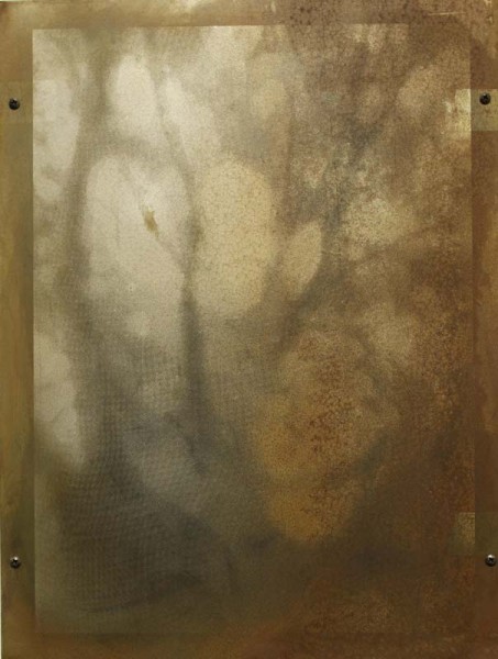 A painting made with stains on a brown sheet of paper forming rounded lines and shapes.