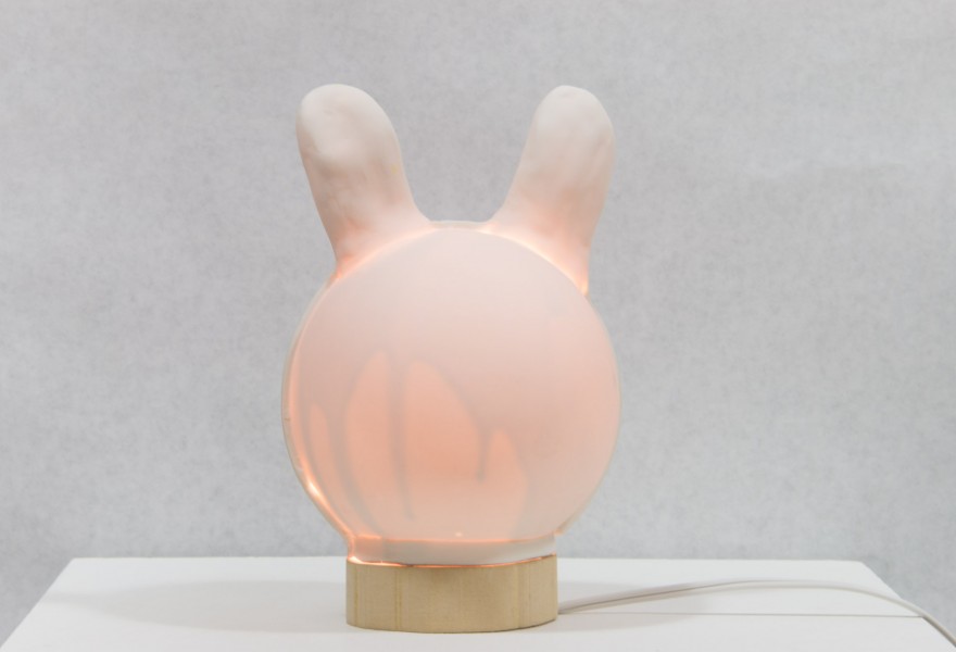 Rounded-shaped sculpture with light inside.
