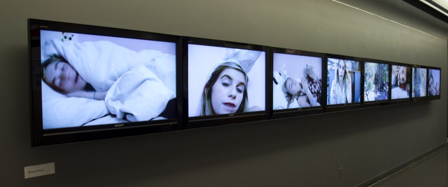 An array of many TV screens with a woman in different scenarios