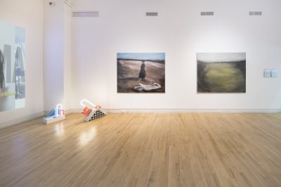 Install shot of two paintings on wall and neon sculpture.