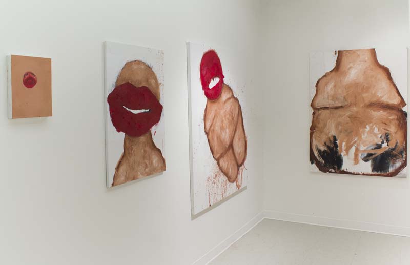 Installation view of four grotesque figure paintings.
