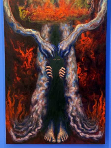 A figure hides inside of the humanoid figures tree trunk like legs. We only see the figures' eyes, fingers, and feet emerging from the darkness within the legs. The humanoid figure and surrounding landscape are on fire.