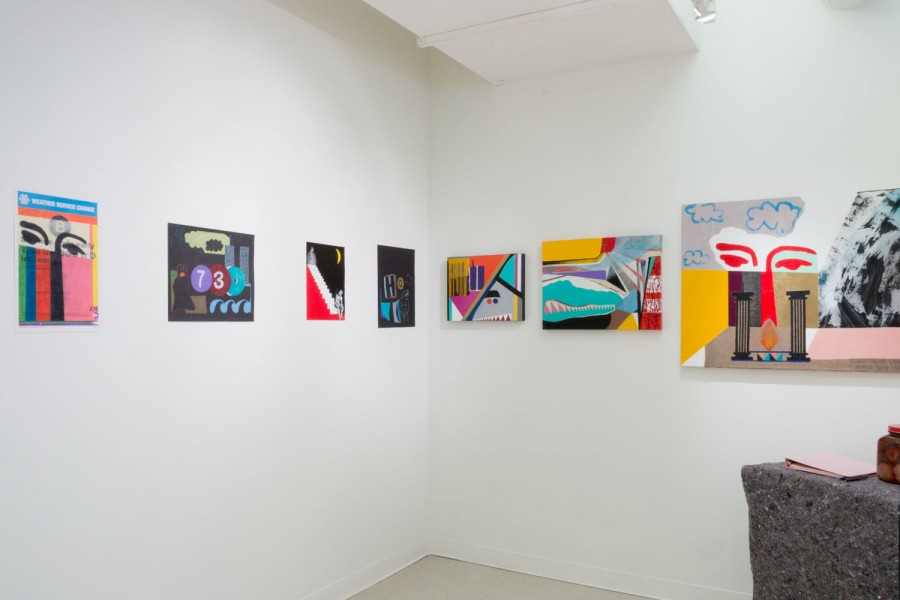 An exhibition view of paintings is arranged on two walls forming a corner in the middle. Paintings represent abstract shapes and forms with angles and rounded lines, and one painting has the number 73 on it