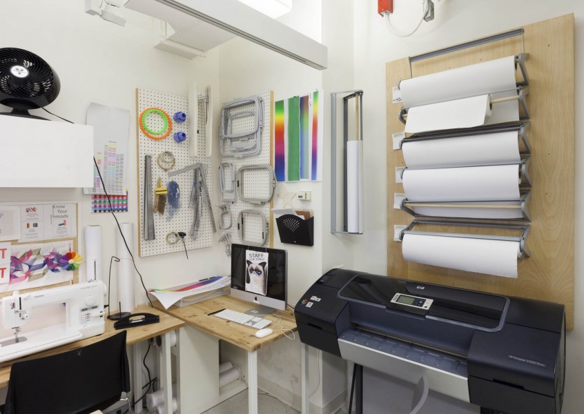 A digital embroidery machine, an iMac workstation, and an inkjet fabric printer in the Fibers Lab. SVA BFA Fine Arts