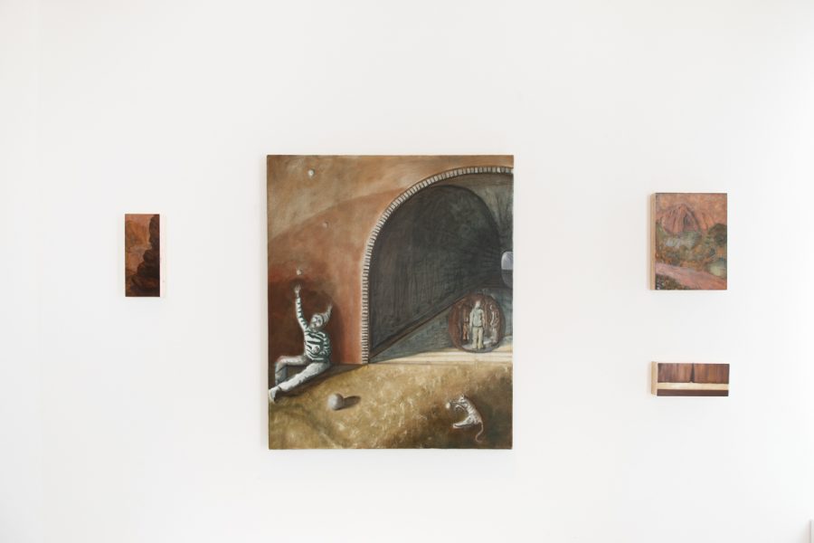 Installation view of artwork by Shunda Wan. Four expressionistic paintings arranged on a wall depicting landscape scenes with the inclusion of figures painted with muted hues.