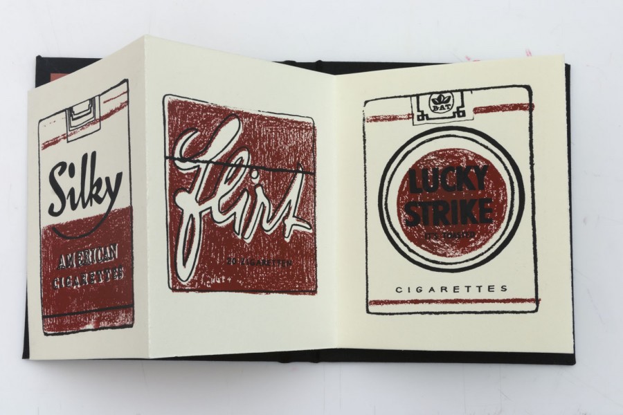 Brochure of Lucky Strike cigarette pack viewed from the back and the front with a small illustration on the middle page saying "flirt" on a red background