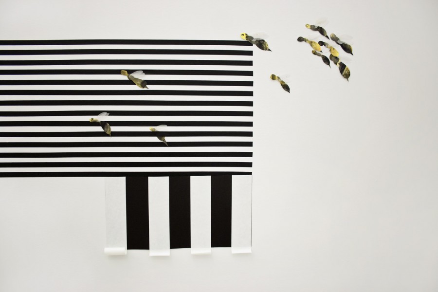 Composition made of cut paper pieces with horizontal thin black and white lines and a few thick blacks and white pieces, and many bee-shapes paper cut