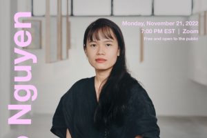 An advertisement for a lecture with Thao Nguyen Phan. Phan wears a black dress and stands in the center of a gallery. Some of her artworks are seen hanging behind her. The event text is printed over the poster in a light pink color.