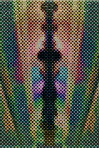 A colorful symmetrical abstraction in blue, green, yellow, and violet with a pattern suggesting offset dots.