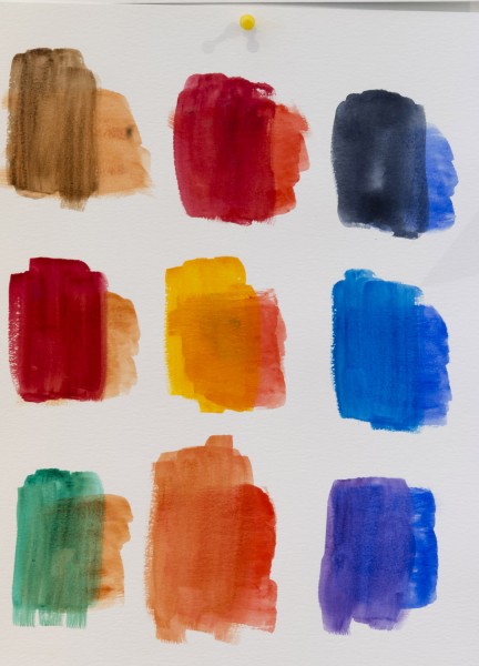 Watercolor painting with brushstrokes of nine colors, including brown, red, yellow, orange, blue, green, dark blue, maroon.