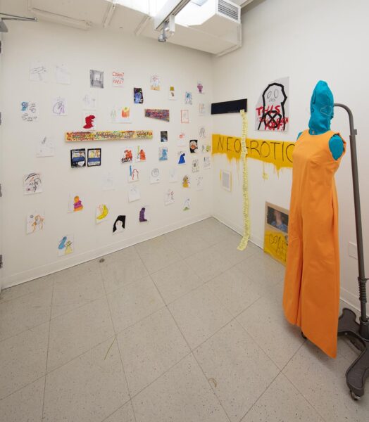 An art installation by Zihao Ren consisting of many small drawings pinned to a white wall, some larger long paintings on an adjacent white wall with Post-It notes hanging down, and a blue armless manikin wearing an orange dress.