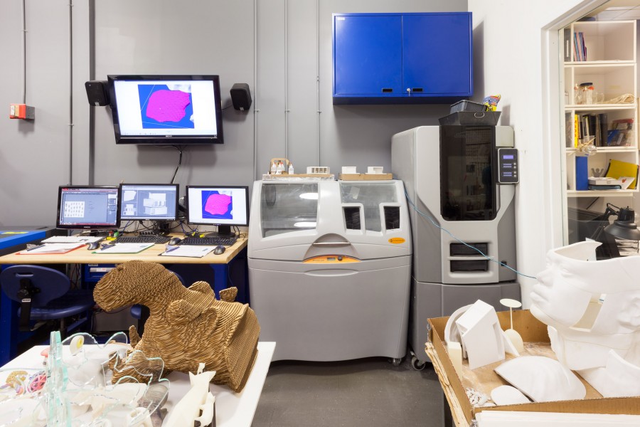An interior view of the CNC Digital Sculpture lab. In the foreground are various works by students in Digital Sculpture. Also visible are two rapid-prototyping machines.