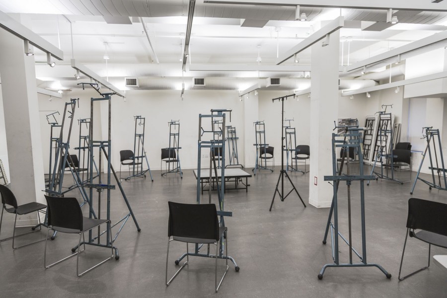 A painting lab equipped with chairs and easels for students