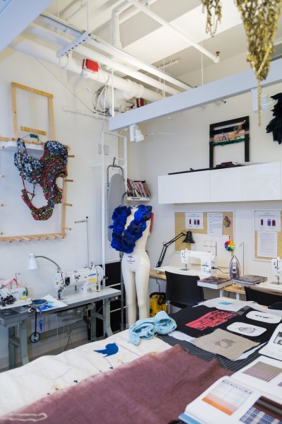 Various student embroidery projects arranged on a table in the Fibers Lab, BFA Fine Arts | SVA