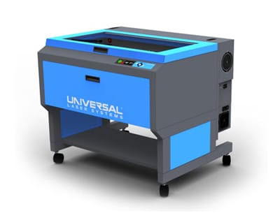 a photograph of a laser engraving machine. The machine has a blue and grey colored body and is set against a white backdrop.