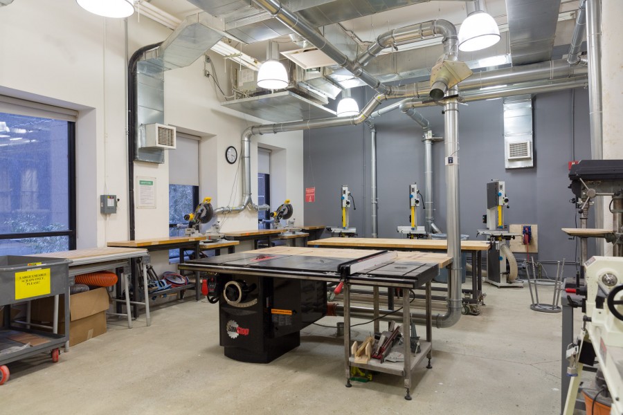 SawStop table saw, saw miter saws and multiple Band Saw in the woodshop.